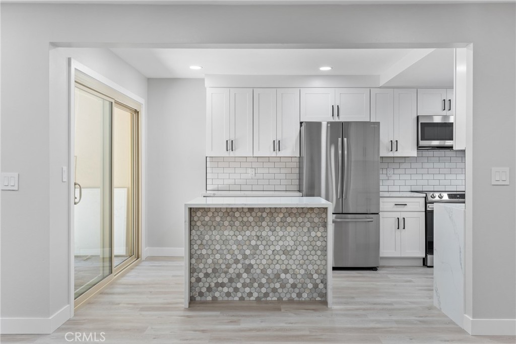 Beautifully upgraded and redone kitchen with center island! - 3008 Club House Circle, Costa Mesa CA 92626 - photo 1