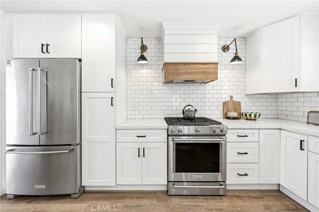 Here's a quick look at the remodeled kitchen w/ Stainless steel Kitchen-aid appliances, & so much more. - 306 Campbell Lane, Costa Mesa CA 92627 - photo 1