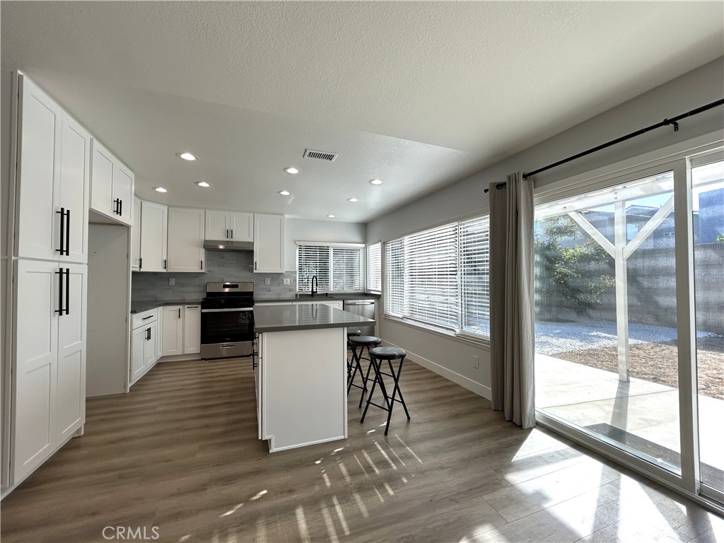 Remodeled kitchen with an island and easy access to the backyard - 3475 Fuchsia, Costa Mesa CA 92626 - photo 4