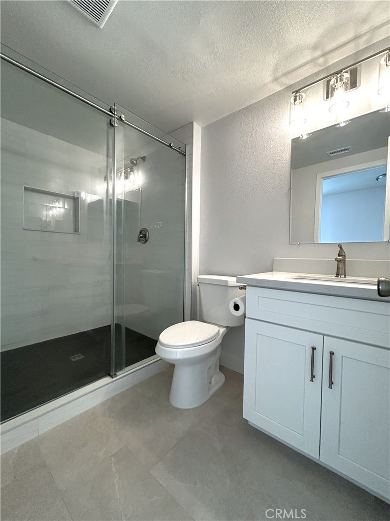 Full bathroom on the main level - 3475 Fuchsia, Costa Mesa CA 92626 - photo 9