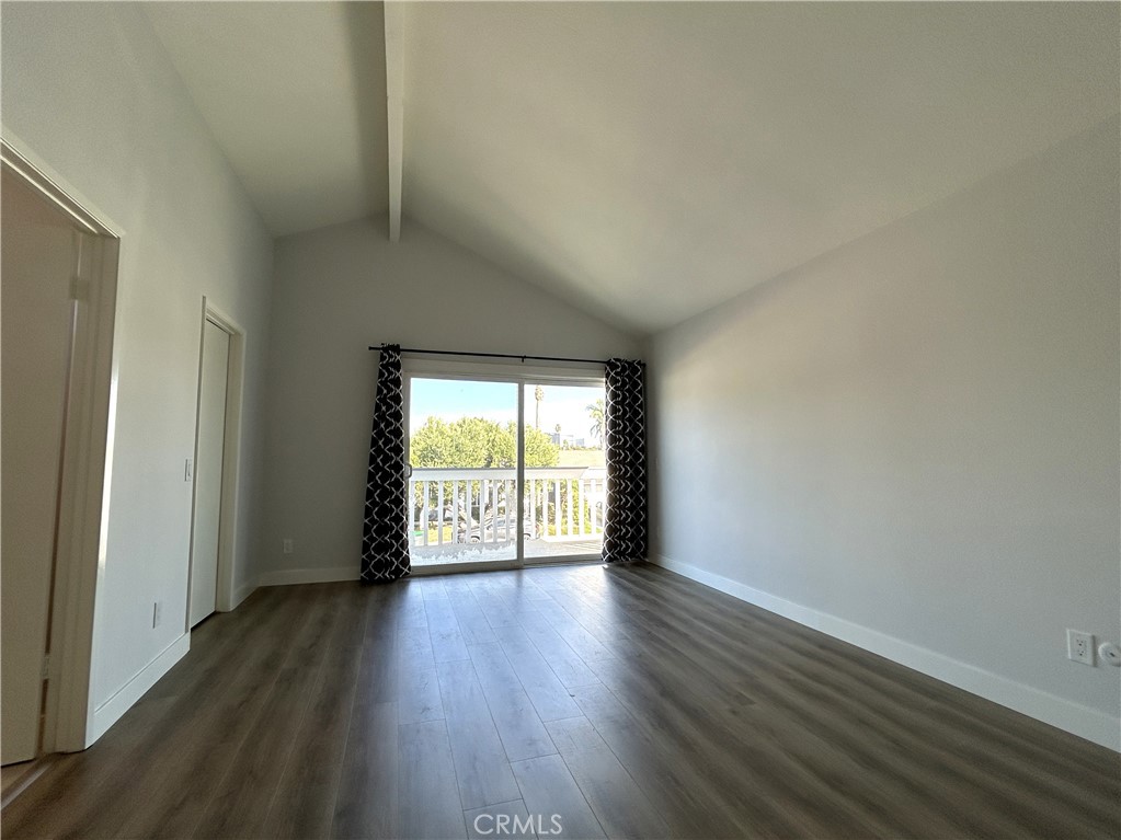 Generous primary bedroom with access to a large private balcony - 3475 Fuchsia, Costa Mesa CA 92626 - photo 11