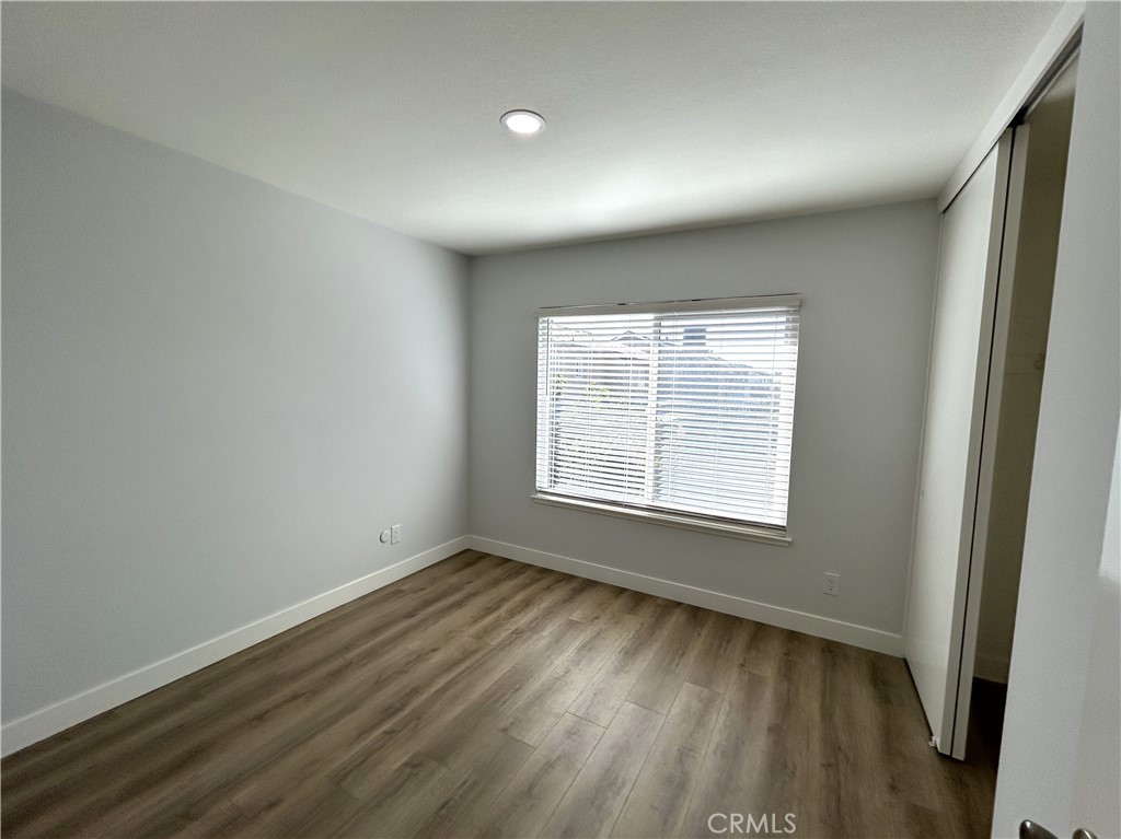 Another light-filled upstairs bedroom - 3475 Fuchsia, Costa Mesa CA 92626 - photo 15