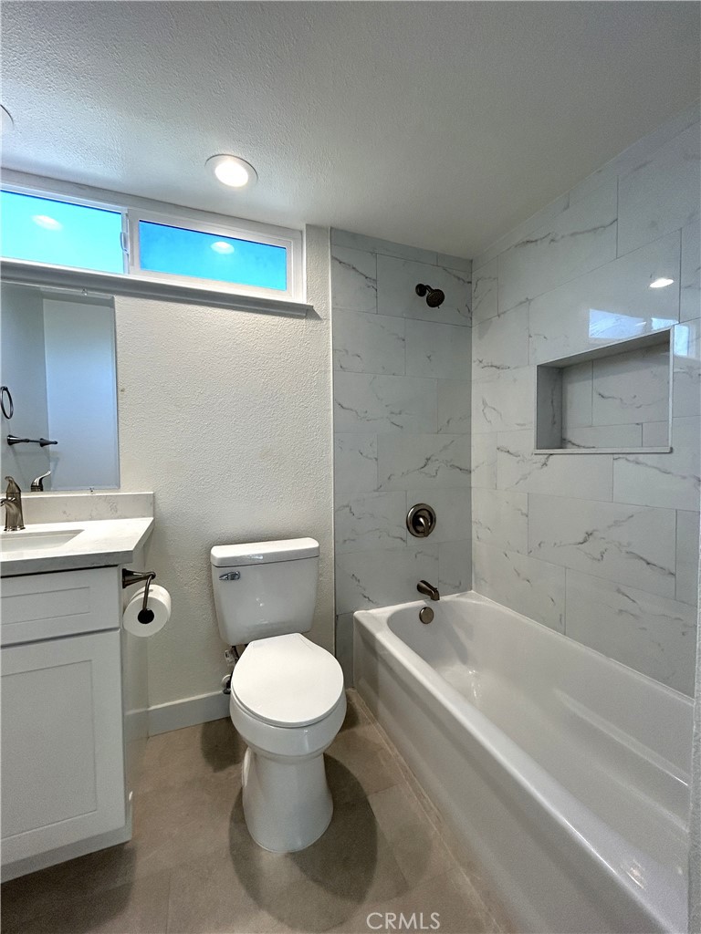 Updated full bathroom serving the upstairs bedrooms - 3475 Fuchsia, Costa Mesa CA 92626 - photo 16