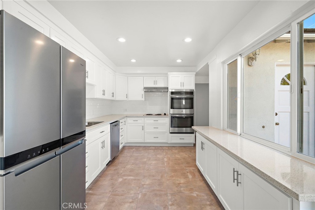 Walking into the kitchen, Refrigerator to stay - 360 Bucknell Road, Costa Mesa CA 92626 - photo 17