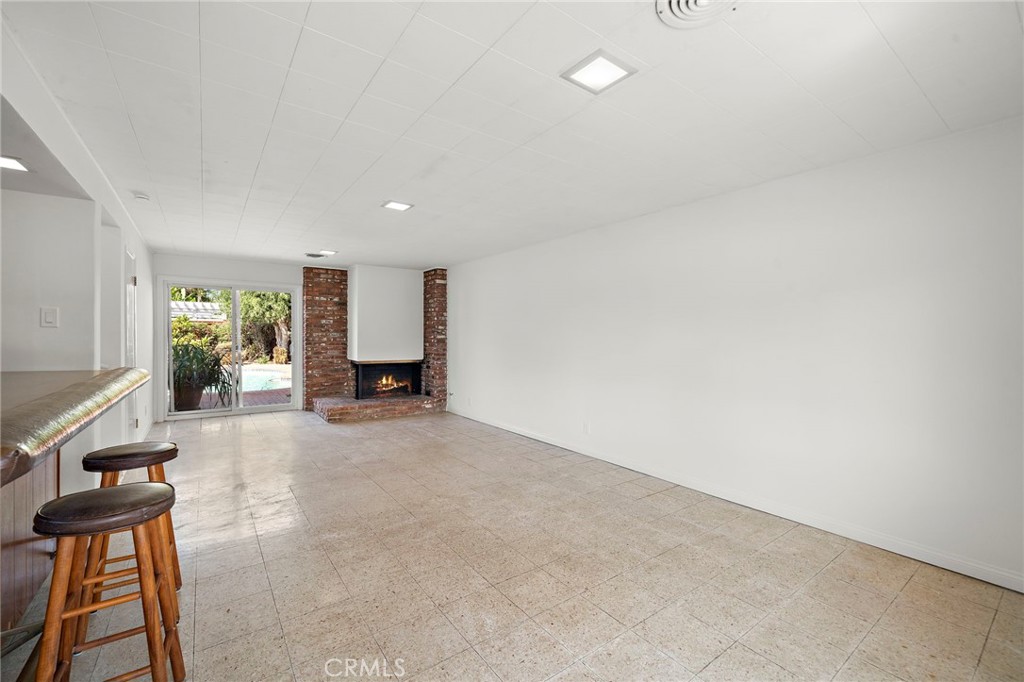 Corner fireplace, slider goes into the backyard - 360 Bucknell Road, Costa Mesa CA 92626 - photo 33