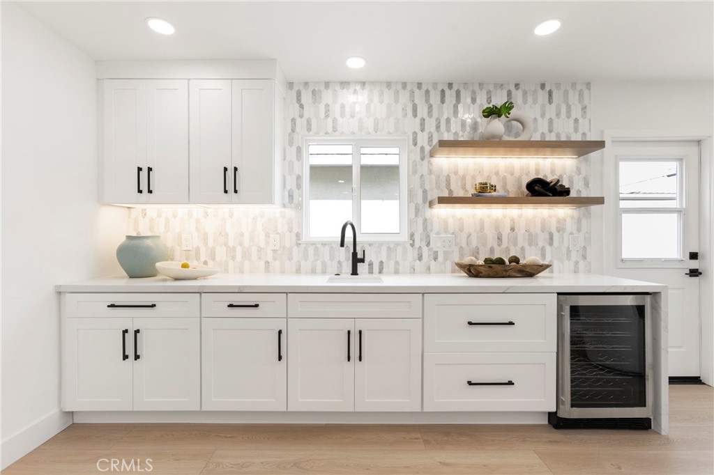 Wet Bar Area of Kitchen with Wine Fridge and Floating Illuminated Shelves - 394 Magnolia Street, Costa Mesa CA 92627 - photo 12