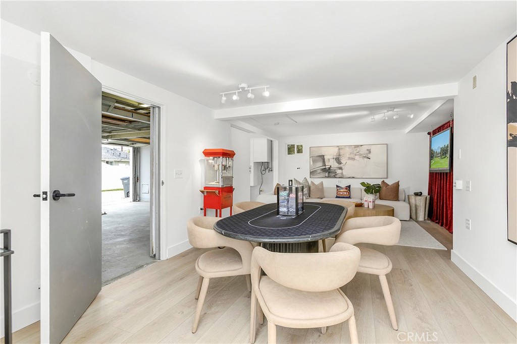 AI Edited TV Pic -Flex Space/Bonus Room off of Garage - Sliding Wall and a Separate Door to Garage are OPEN to Garage in - 394 Magnolia Street, Costa Mesa CA 92627 - photo 58