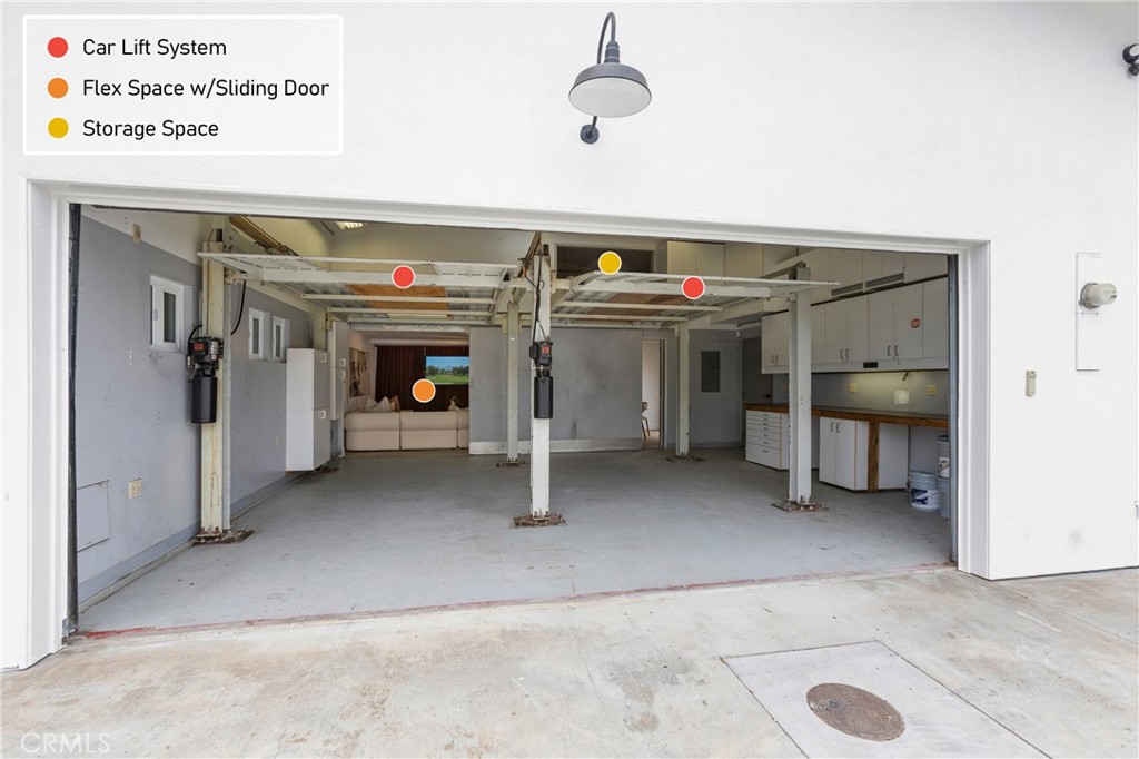 AI Edited TV Pic - 2 Car Lifts to make a 4 Car Garage - Sliding Wall is OPEN to Flex Space. Spacious Storage/Attic over - 394 Magnolia Street, Costa Mesa CA 92627 - photo 61