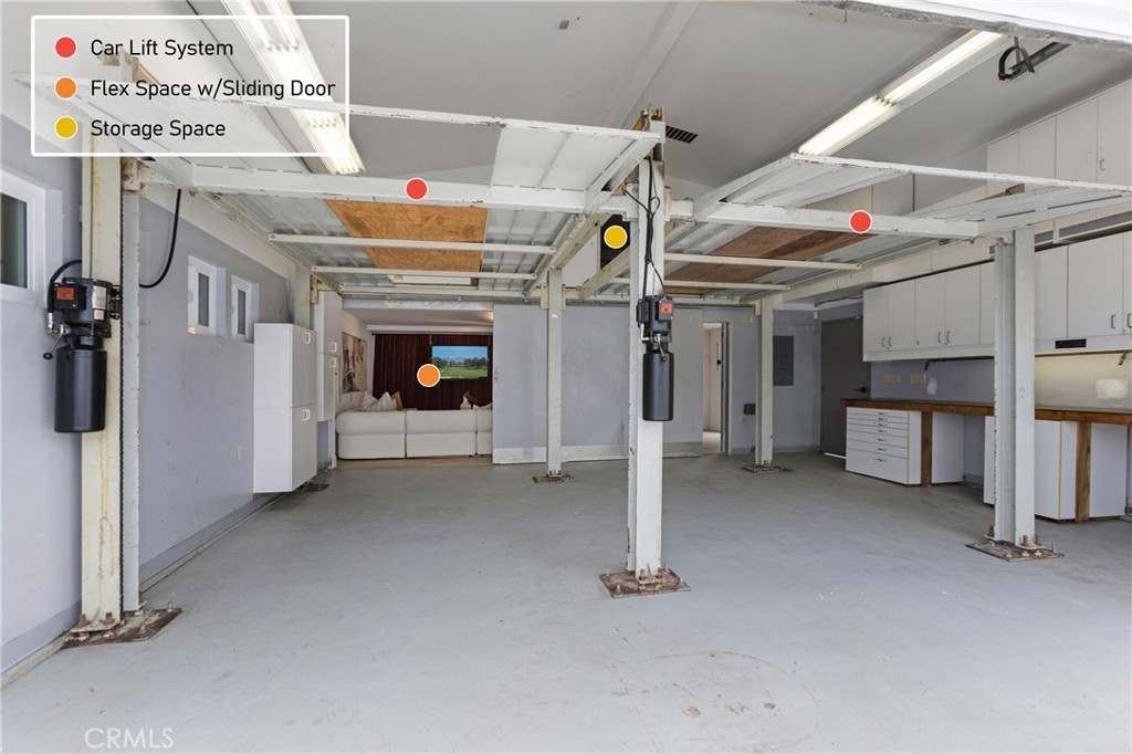 AI Edited TV Pic - 2 Car Lifts to make a 4 Car Garage - Sliding Wall is OPEN to Flex Space. Spacious Storage/Attic over - 394 Magnolia Street, Costa Mesa CA 92627 - photo 63