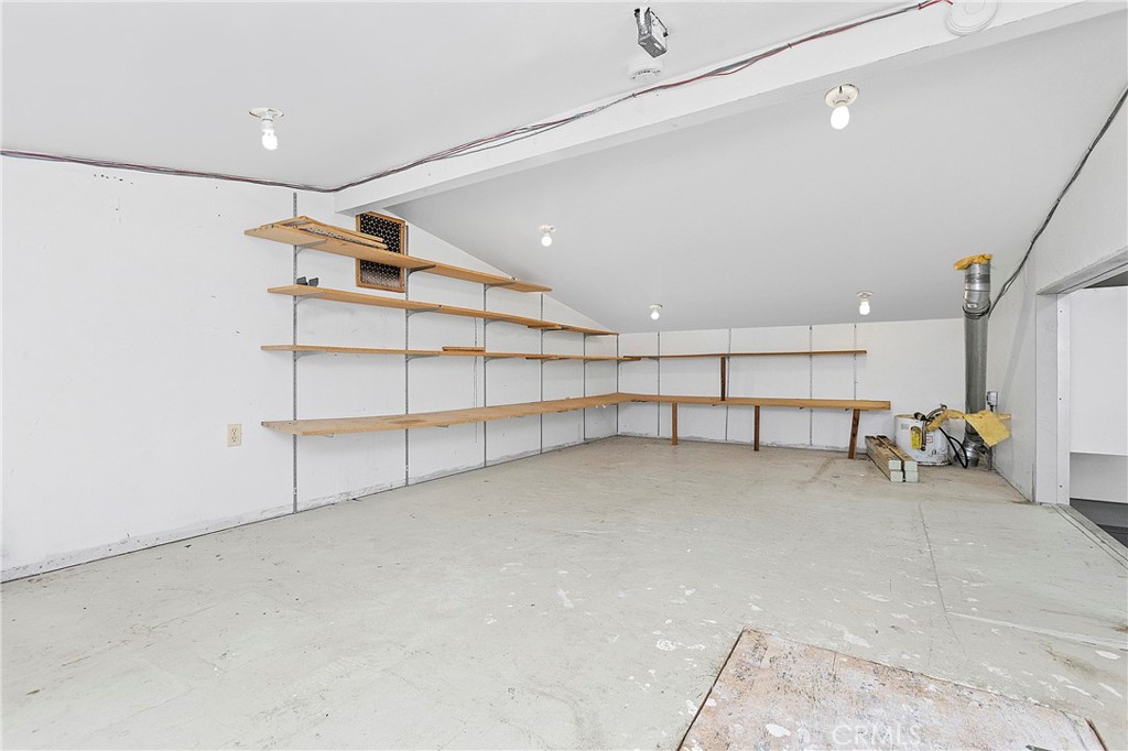 Storage Over Flex Space looking out to garage w/ drop down stairs (Attic) - 394 Magnolia Street, Costa Mesa CA 92627 - photo 66