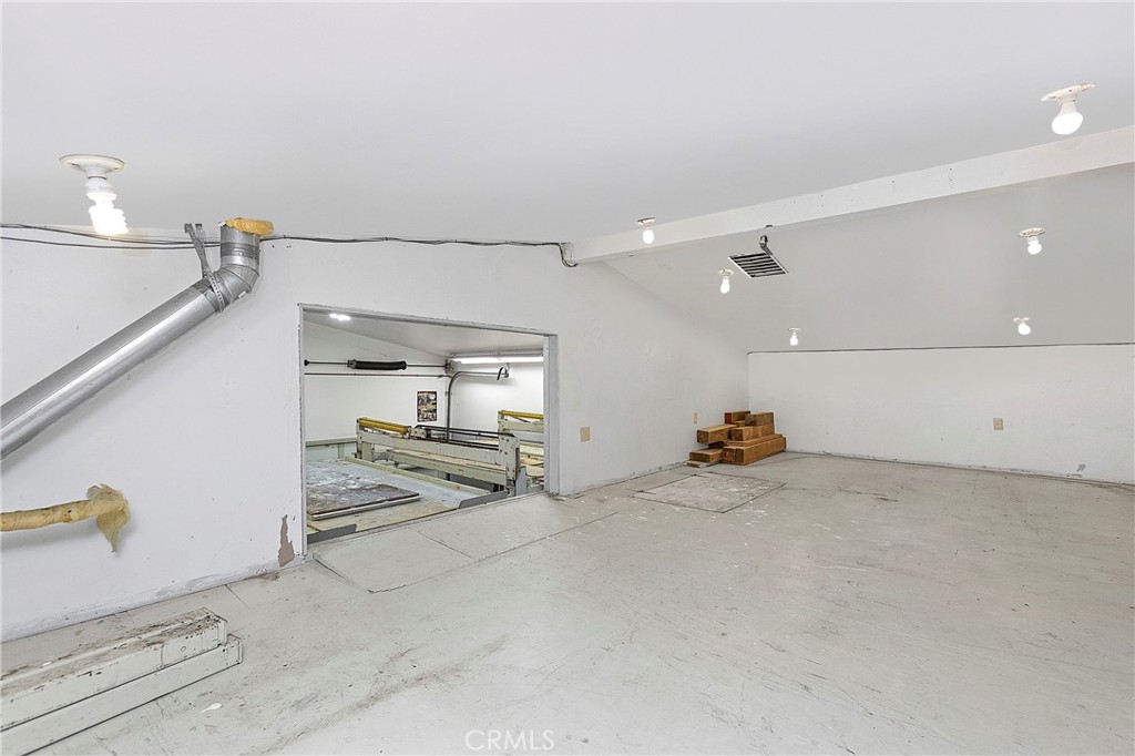 Storage Over Flex Space looking out to garage w/ drop down stairs (Attic) - 394 Magnolia Street, Costa Mesa CA 92627 - photo 67