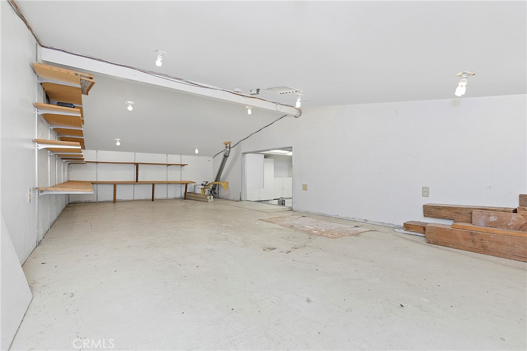 Storage Over Flex Space looking out to garage w/ drop down stairs (Attic) - 394 Magnolia Street, Costa Mesa CA 92627 - photo 68