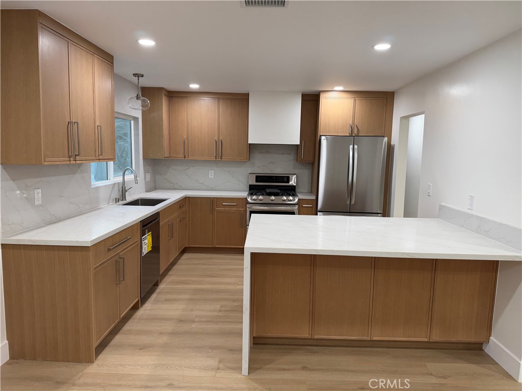 "Fully renovated kitchen to include all stainless steel appliances" - 685 Center St, Costa Mesa CA 92627 - photo 2
