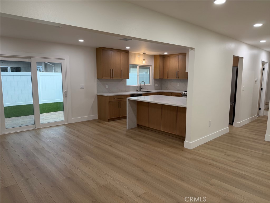 "Kitchen opens to dining and family room" - 685 Center St, Costa Mesa CA 92627 - photo 5