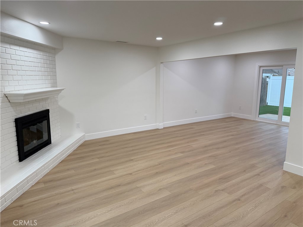 "Open floor plan with new laminate flooring" - 685 Center St, Costa Mesa CA 92627 - photo 7