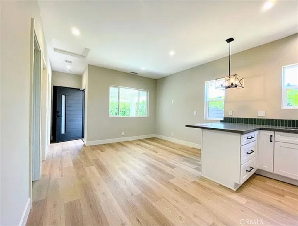 another view of livingroom/kitchen - 738 Center C, Costa Mesa CA 92627 - photo 7