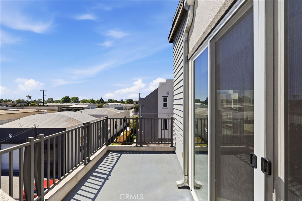 Balcony off of the living room with stairs to the rooftop deck - 783 Wonder Lane, Costa Mesa CA 92627 - photo 25
