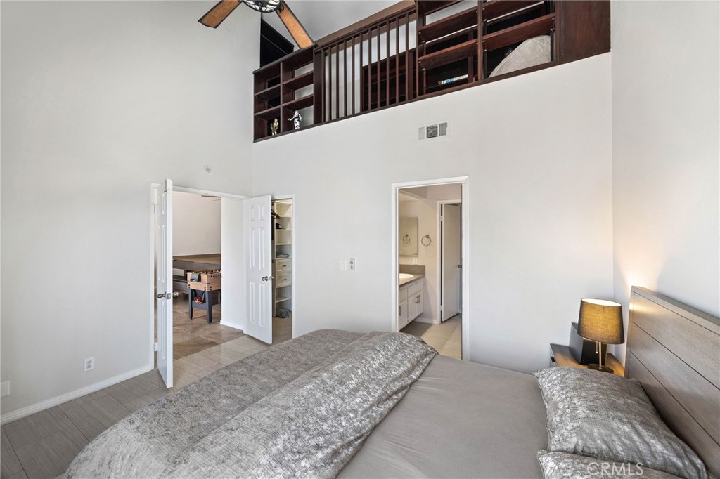 A loft above the primary bedroom is accessible from a pull down staircase - 810 Baker 210, Costa Mesa CA 92626 - photo 11