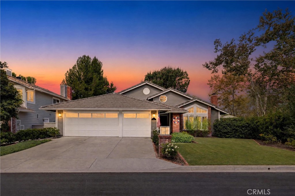 Meticulous curb appeal showcases the home’s welcoming front exterior, beautifully framed by mature landscaping. Virtuall - 1 Pinewood, Coto de Caza CA 92679 - photo 1