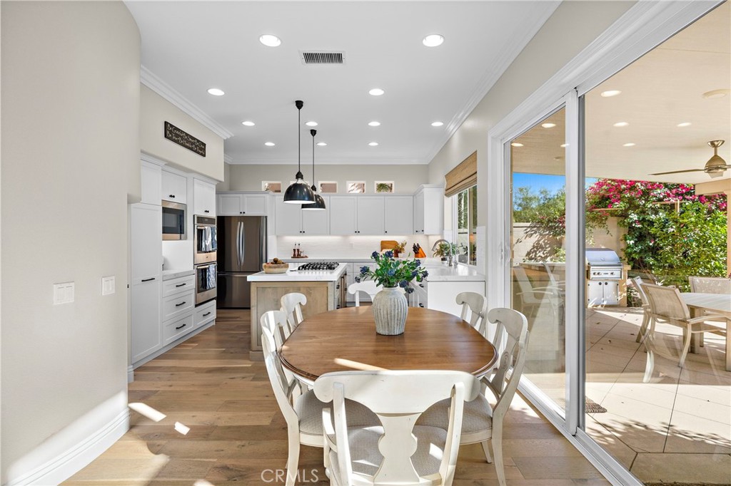The casual dining area between the kitchen and family room is spacious and yet intimate. - 17 Raleigh Court, Coto de Caza CA 92679 - photo 10