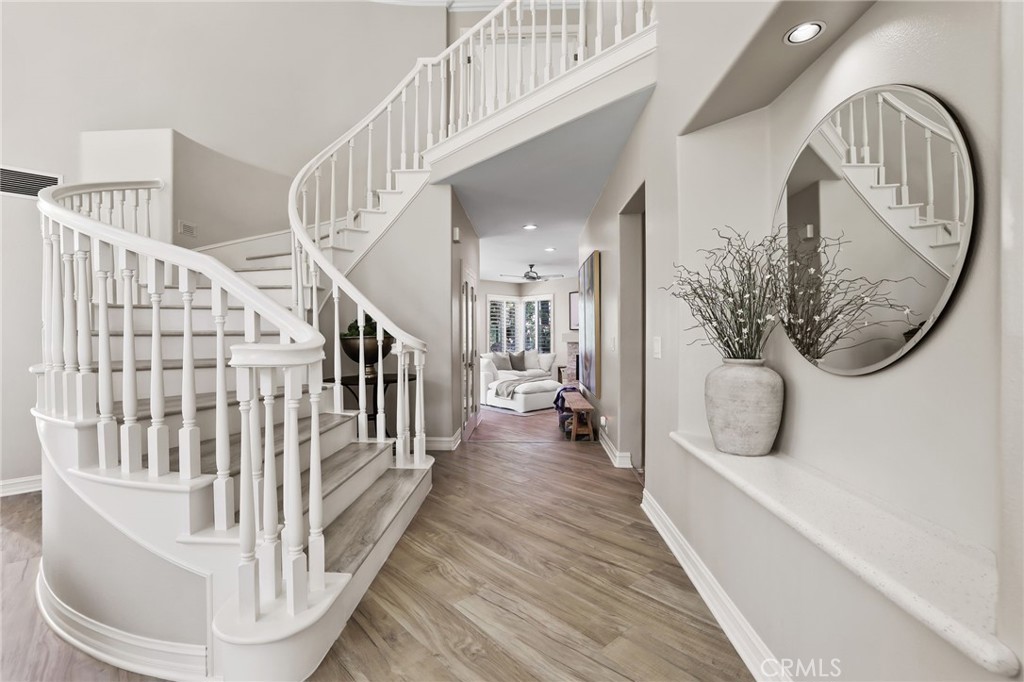 Stunning wide plank floors throughout~sweeping staircase leads to 4 upstairs bedrooms - 5 Mountain Gate, Coto de Caza CA 92679 - photo 29