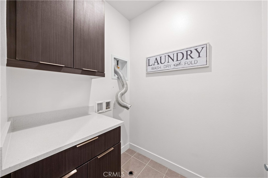 Laundry Room - 10301 Triple Crown Lane, Cypress CA 90720 - photo 23