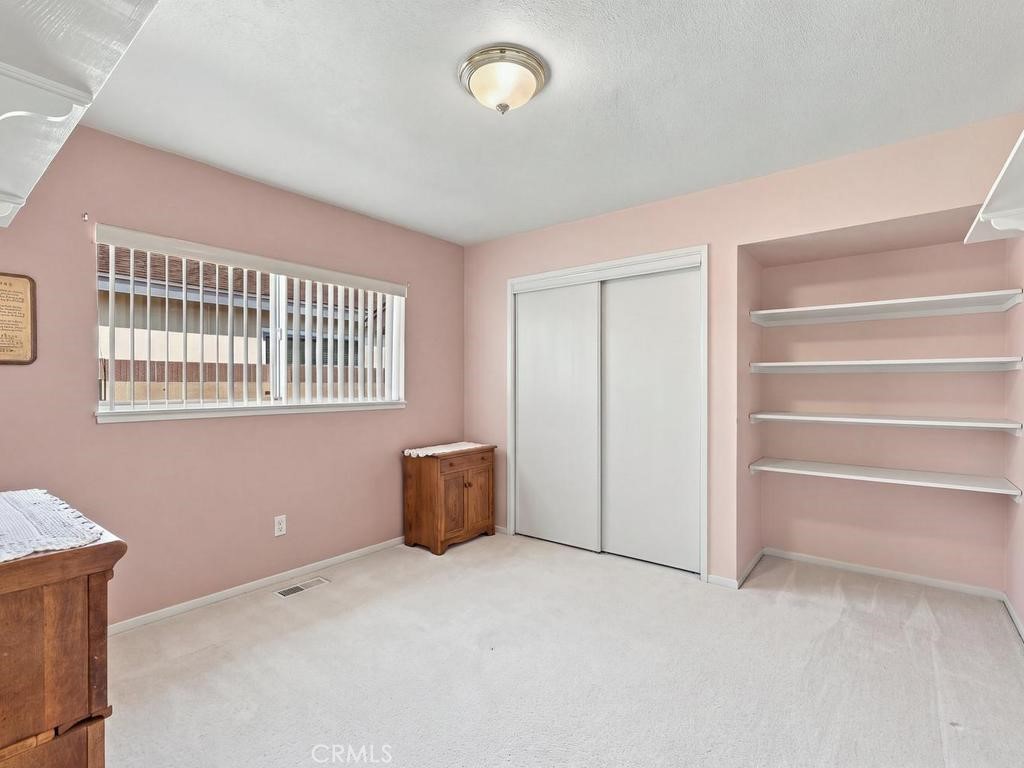 this photo has been modified to show an empty room, there is not a vent in floor as shown in photo - 10471 Saint Alban Street, Cypress CA 90630 - photo 27
