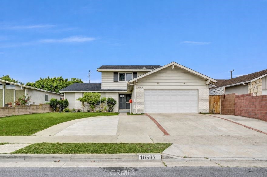 Nice curb appeal with synthetic grass in front yard - 10593 Jill Street, Cypress CA 90630 - photo 1
