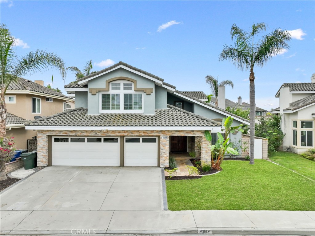 The Collection Plan Three at Sorrento - 3,350 sq ft of living space * Three-car garage with roll-up doors and windows pl - 4644 Portofino Circle, Cypress CA 90630 - photo 1
