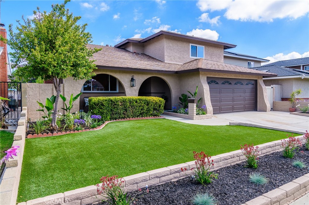 Clean eye catching curb appeal featuring new exterior paint. Low maintenance "no mow" lawn. - 6851 Reefton Avenue, Cypress CA 90630 - photo 1