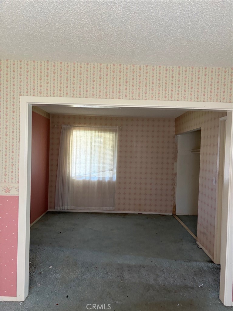 downstairs bedroom put wall back up to separate rooms - 6859 Tahiti, Cypress CA 90630 - photo 17