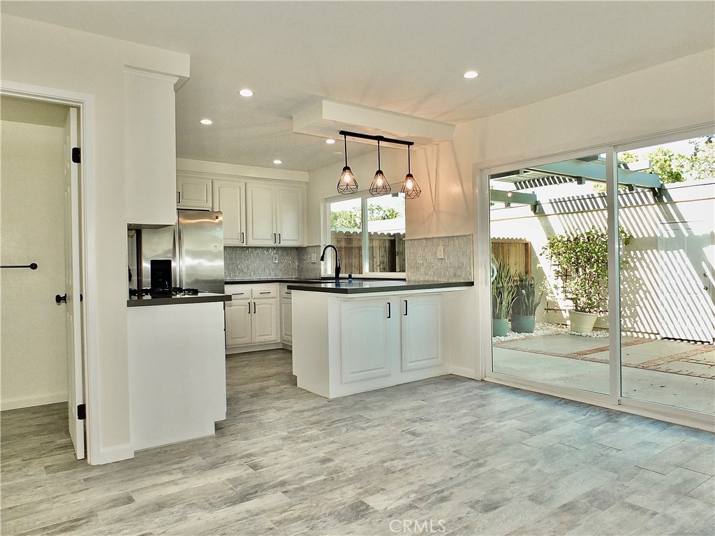 Dining Family Area to Kitchen - 6884 Breton, Cypress CA 90630 - photo 7