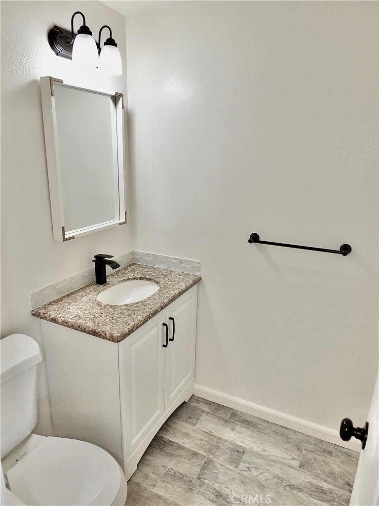 Half Bath off family area - 6884 Breton, Cypress CA 90630 - photo 16