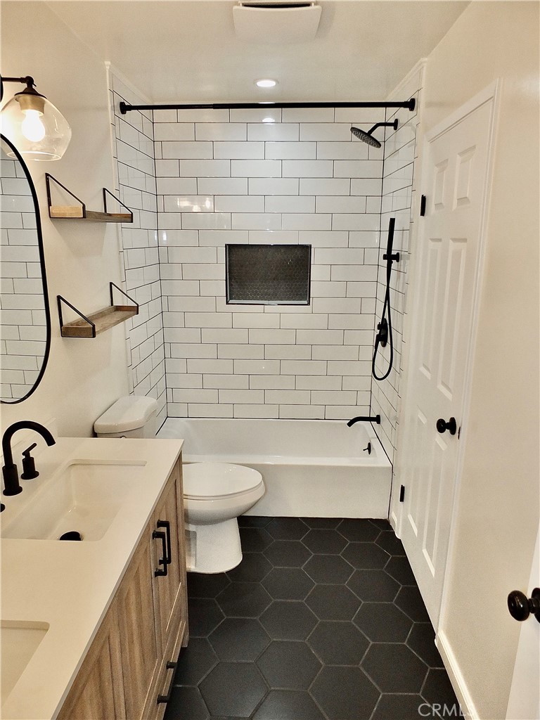 Full bath off hall and primary bedroom - 6884 Breton, Cypress CA 90630 - photo 25