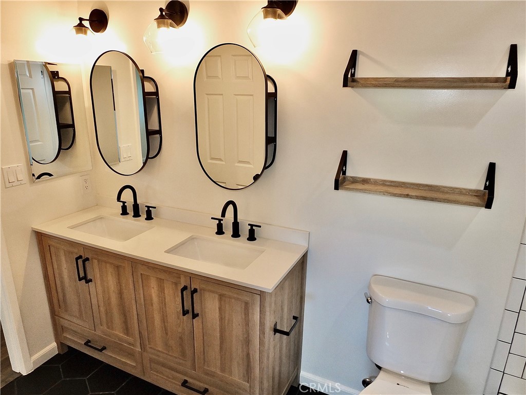 Full Bath off Primary Bedroom and hall - 6884 Breton, Cypress CA 90630 - photo 26