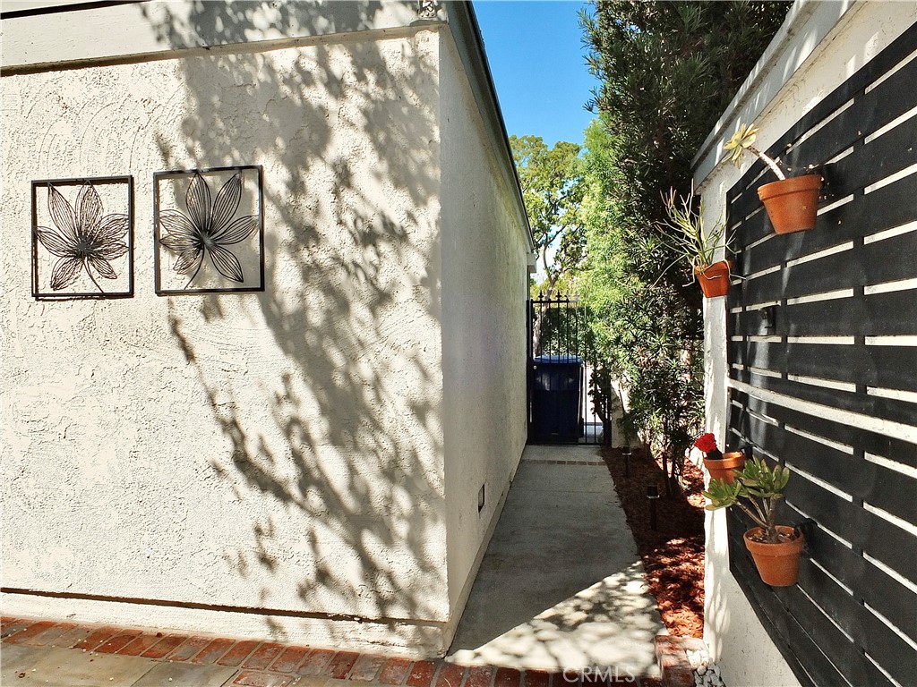 Walkway with gate to rear alley - 6884 Breton, Cypress CA 90630 - photo 37