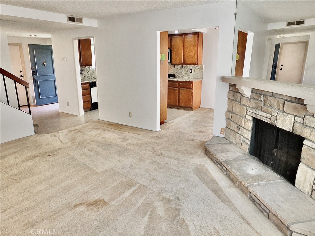 Spacious family room open to the breakfast room off the kitchen. - 8485 Kington Way 11, Cypress CA 90630 - photo 3