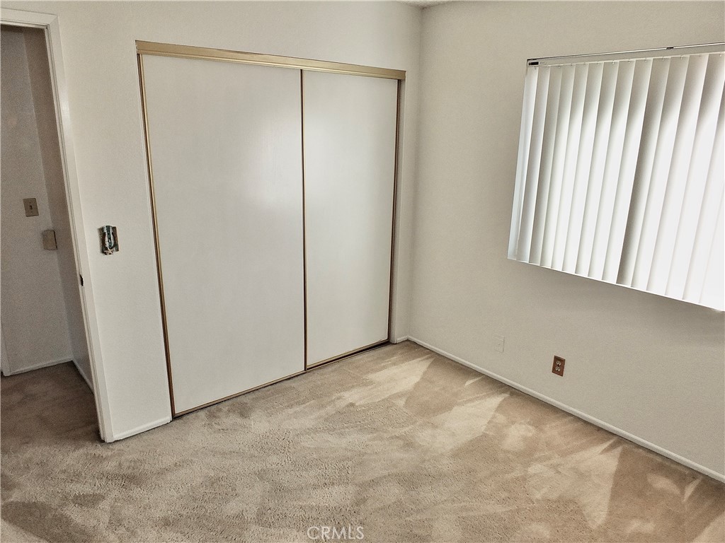 Second bedroom. - 8485 Kington Way 11, Cypress CA 90630 - photo 17