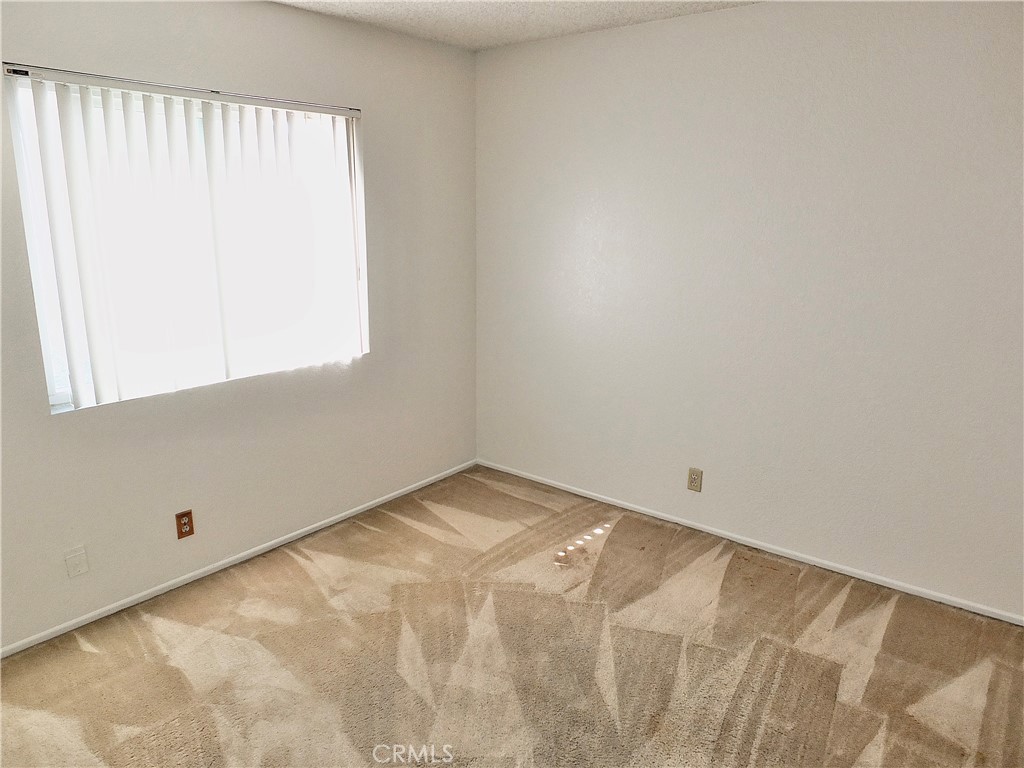 Second bedroom. - 8485 Kington Way 11, Cypress CA 90630 - photo 18
