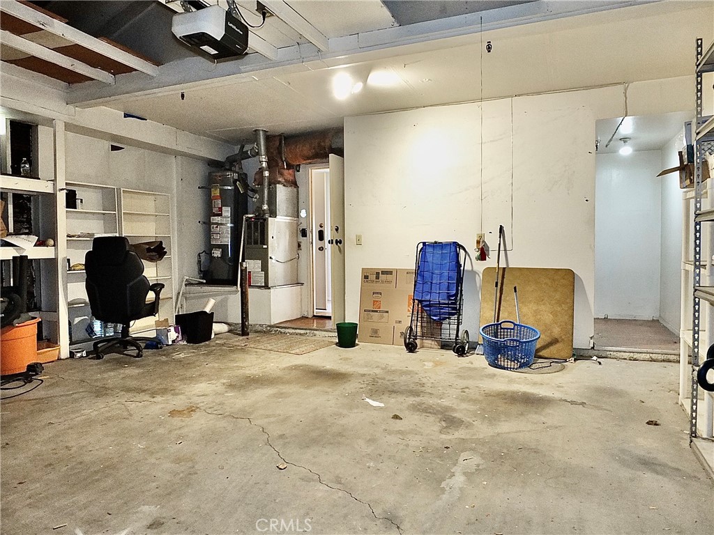 To the left of the center wall there is direct access to the condo and to the right is the laundry area. - 8485 Kington Way 11, Cypress CA 90630 - photo 34