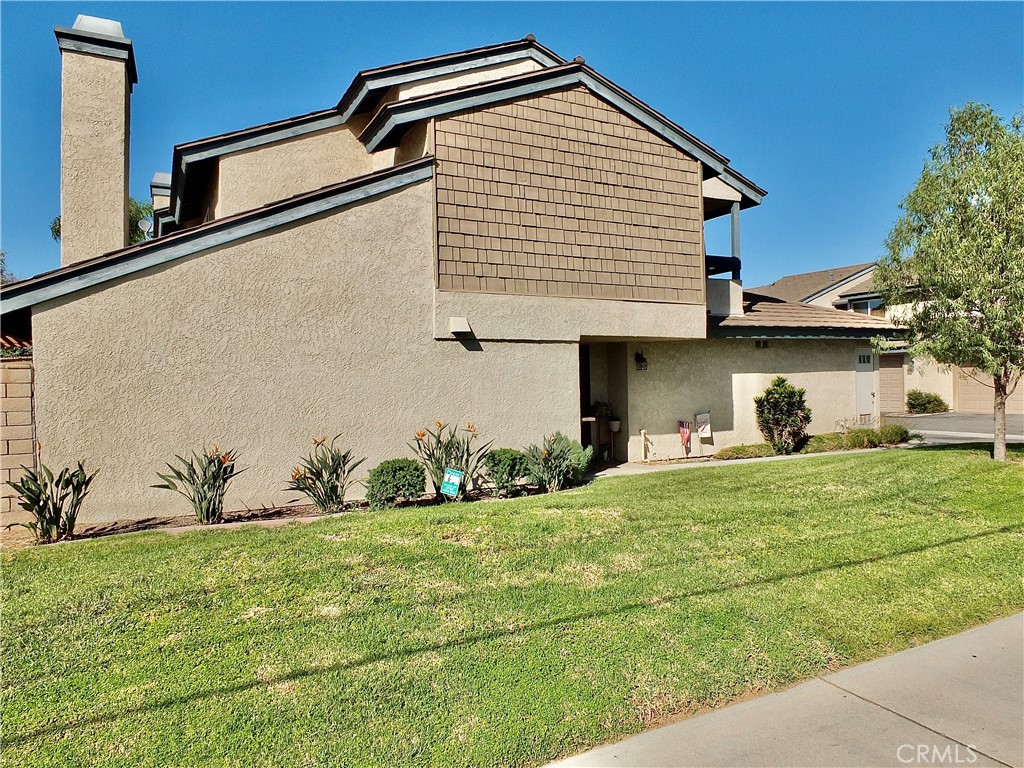 The end unit has a great green belt. - 8485 Kington Way 11, Cypress CA 90630 - photo 36
