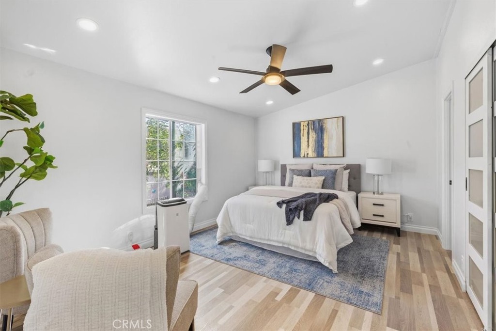 Master Spacious bedroom with vaulted ceiling, ceiling fan and recessed lighting. - 9080 Bloomfield Avenue 153, Cypress CA 90630 - photo 13