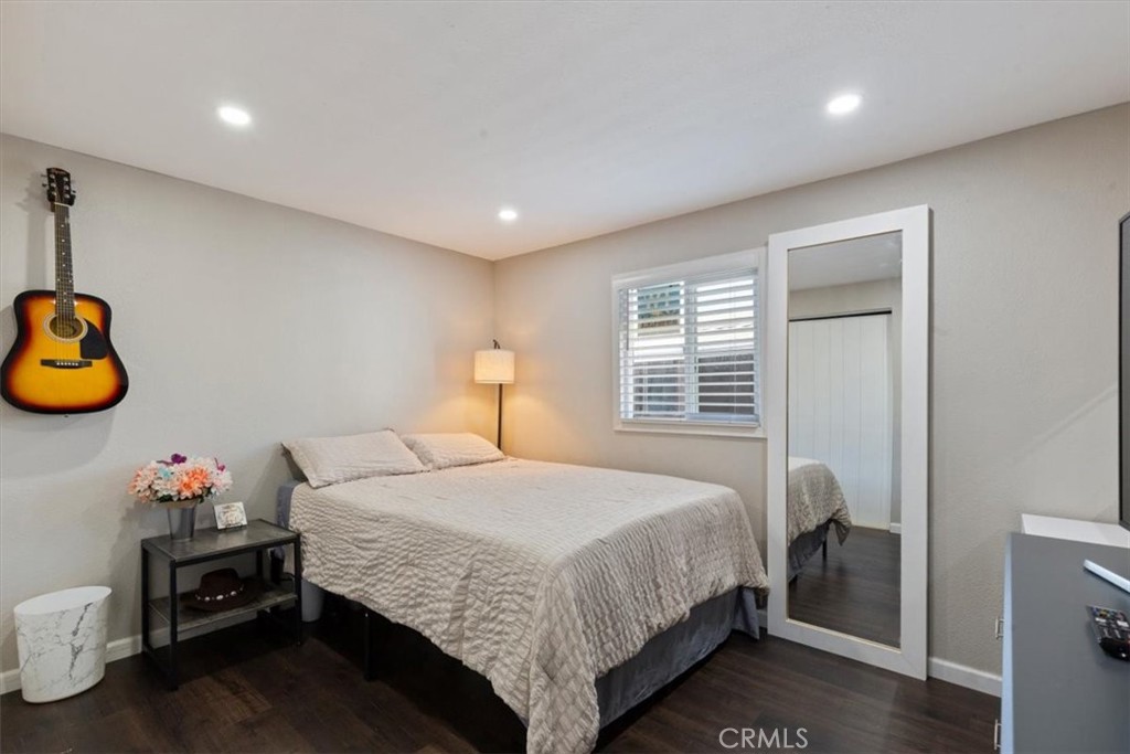 Bedroom 3: Flexible third bedroom with updated flooring, recessed lighting, neutral finishes, and space for bedroom, off - 9080 Bloomfield Avenue 293, Cypress CA 90630 - photo 13