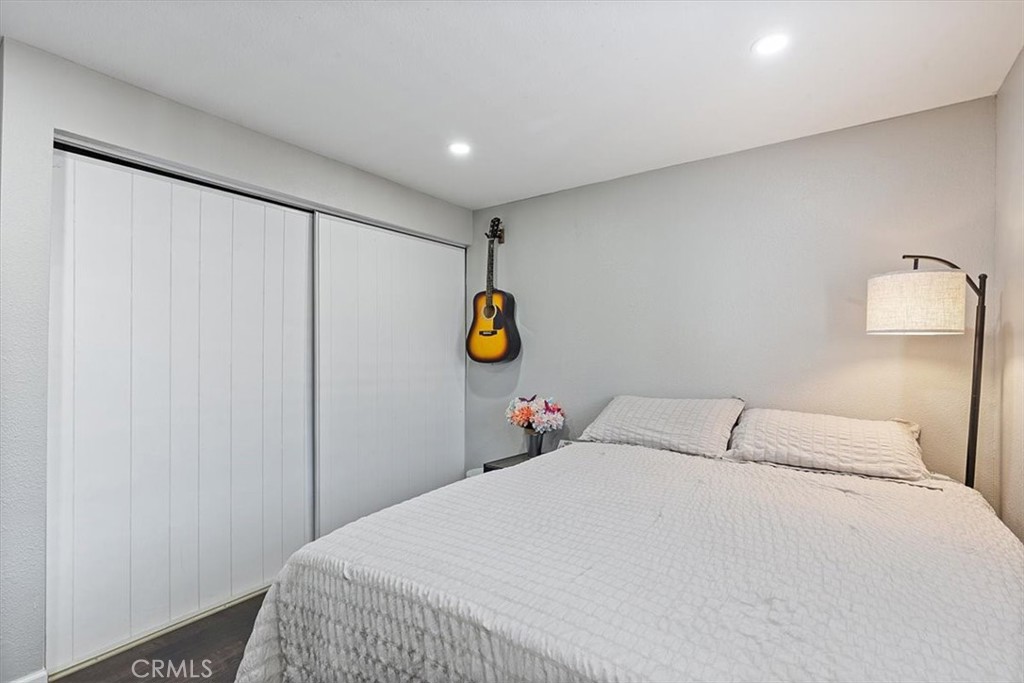 Bedroom 3: Flexible third bedroom with updated flooring, recessed lighting, neutral finishes, and space for bedroom, off - 9080 Bloomfield Avenue 293, Cypress CA 90630 - photo 14
