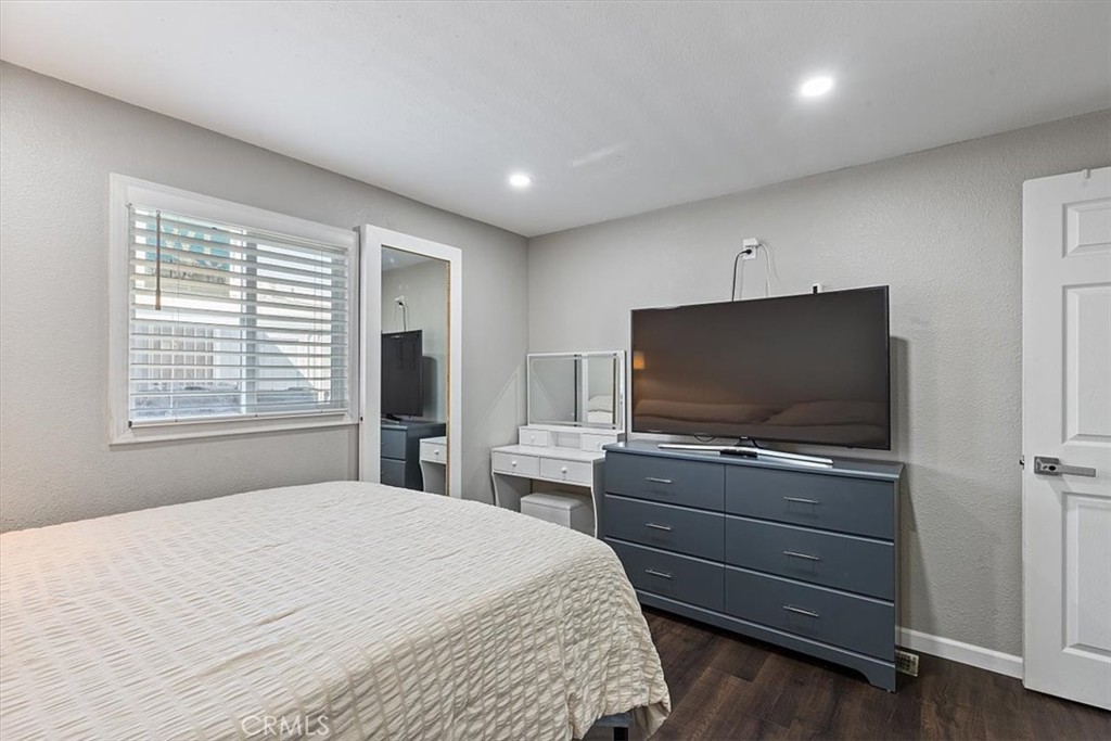 Bedroom 3: Flexible third bedroom with updated flooring, recessed lighting, neutral finishes, and space for bedroom, off - 9080 Bloomfield Avenue 293, Cypress CA 90630 - photo 15