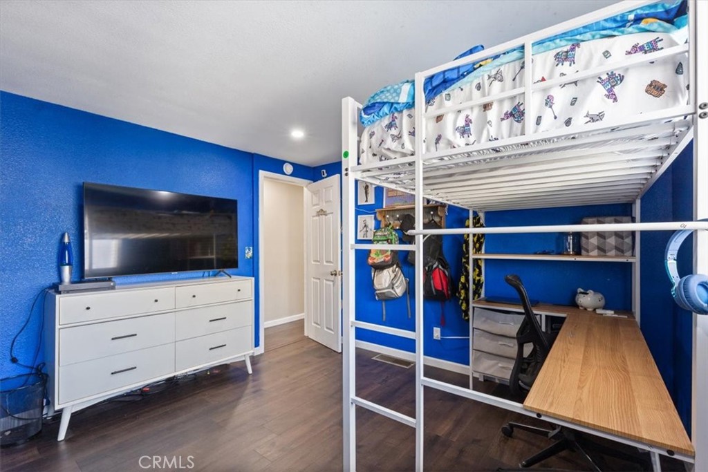 Spacious secondary bedroom with updated flooring, recessed lighting, neutral finishes, and flexible space for sleeping, - 9080 Bloomfield Avenue 293, Cypress CA 90630 - photo 20