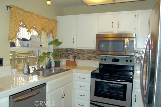 Spacious Kitchen with Stainless Steel Appliances, dual sinks and Garden window All with plenty of cabinet storage - 12 Corniche Drive A, Dana Point CA 92629 - photo 1