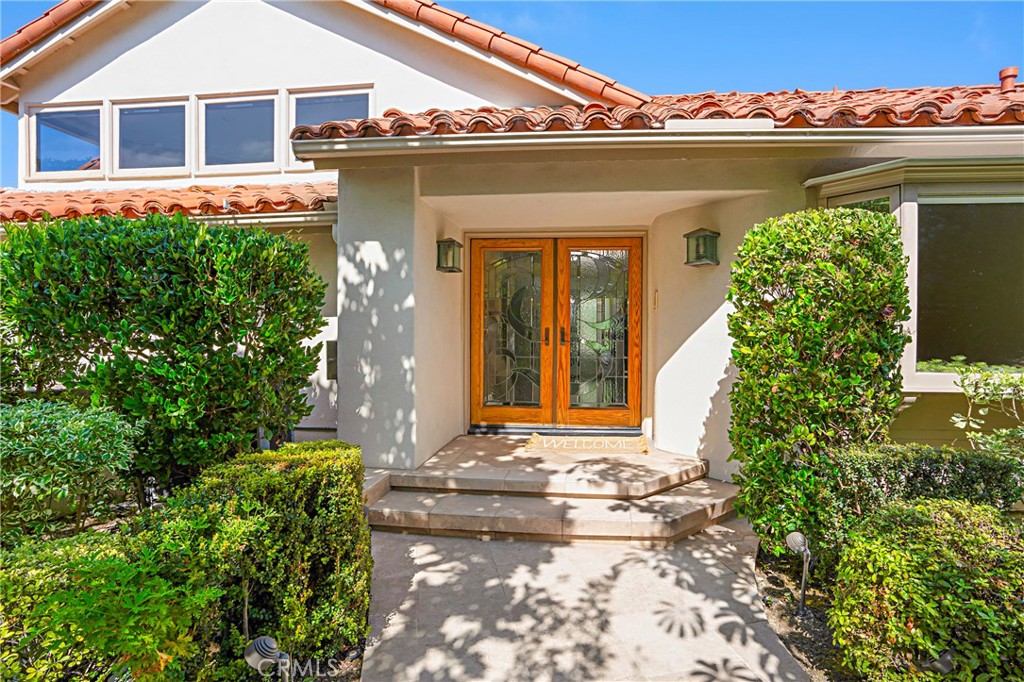 Beautiful front door of the home with artistic cut leaded glass - 12 Los Monteros Drive, Dana Point CA 92629 - photo 1