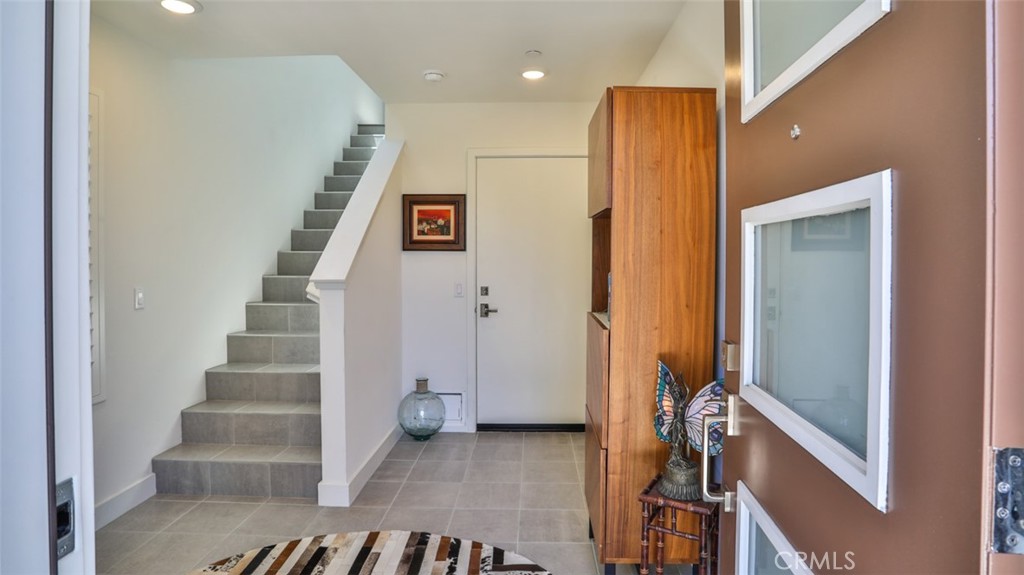 Foyer off of front patio and direct access from attached 3-car garage. - 1207 Doheny Way, Dana Point CA 92629 - photo 3