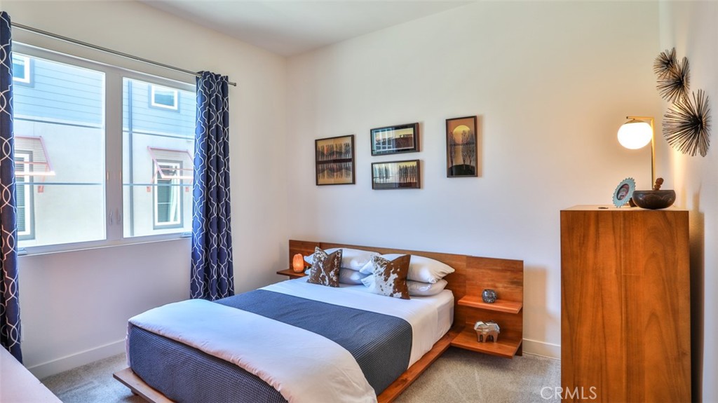 Secondary bedroom with walk-in closet and next to full hall bathroom. - 1207 Doheny Way, Dana Point CA 92629 - photo 29